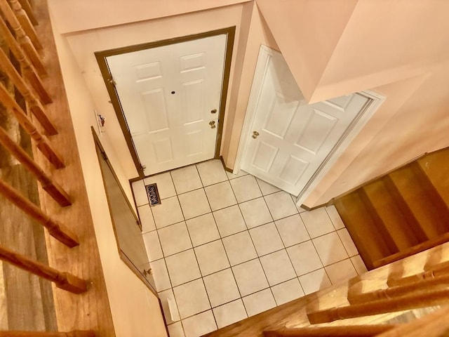 doorway to outside featuring light tile patterned floors