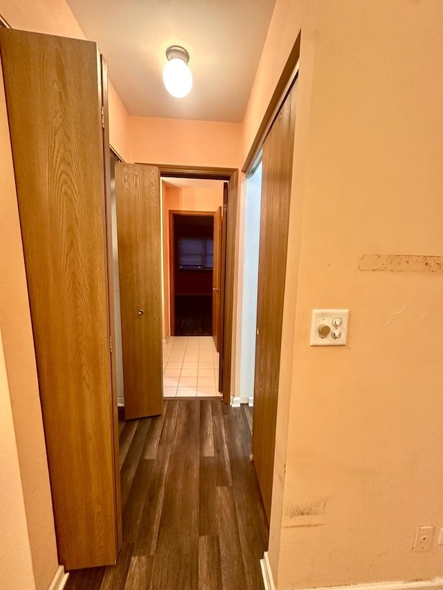 hallway featuring dark wood-style flooring