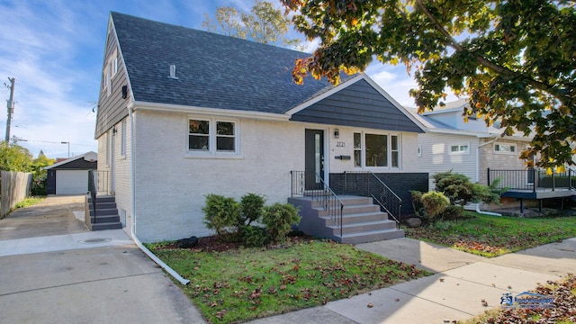 view of front of property featuring an outbuilding and a garage