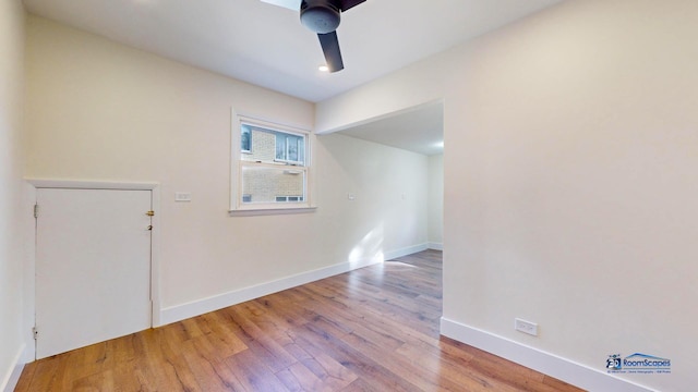 unfurnished room featuring hardwood / wood-style floors and ceiling fan