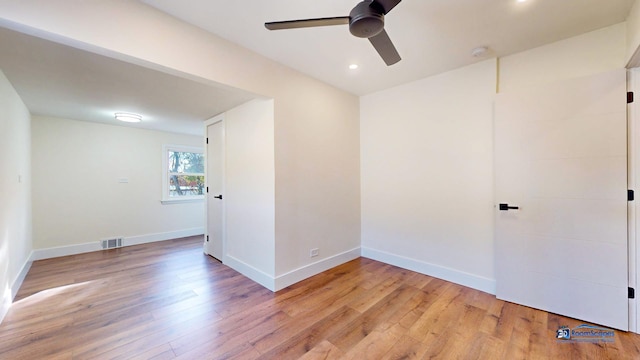 spare room featuring ceiling fan and light wood-type flooring