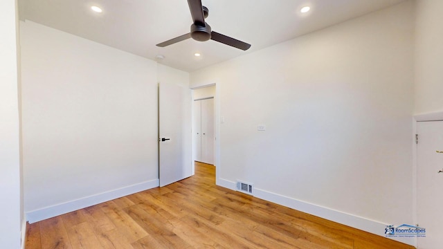 unfurnished room featuring ceiling fan and light wood-type flooring