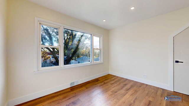 spare room featuring hardwood / wood-style floors