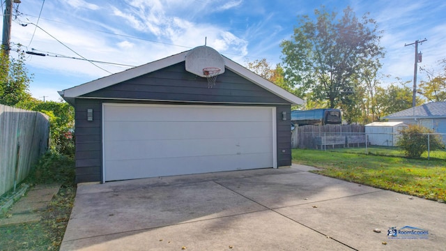 garage featuring a yard