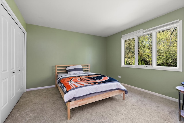 bedroom featuring a closet and carpet flooring