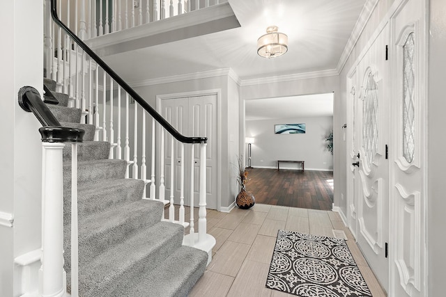 foyer entrance featuring ornamental molding