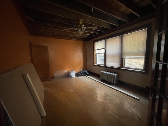 spare room featuring radiator and ceiling fan