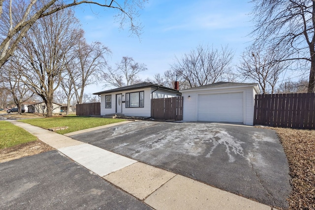 single story home with a garage and a front lawn