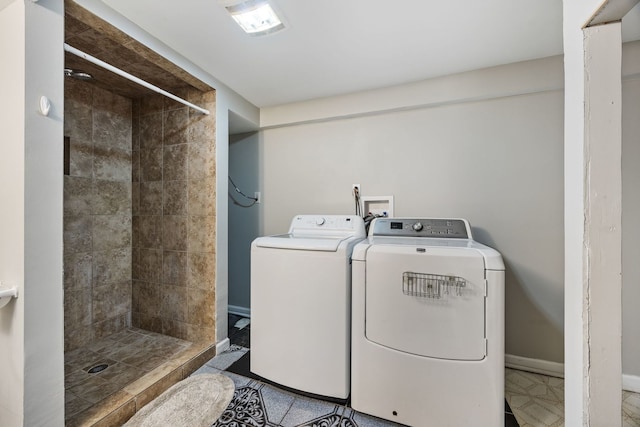 clothes washing area featuring washing machine and clothes dryer