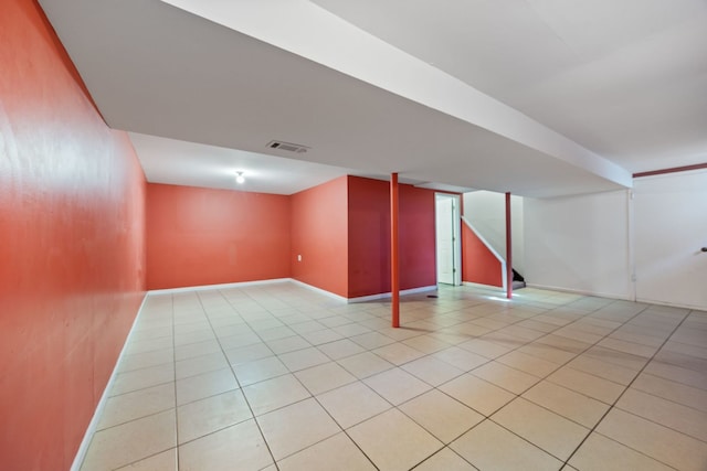 basement with light tile patterned flooring