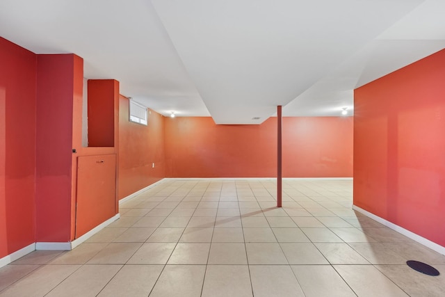 basement with light tile patterned flooring