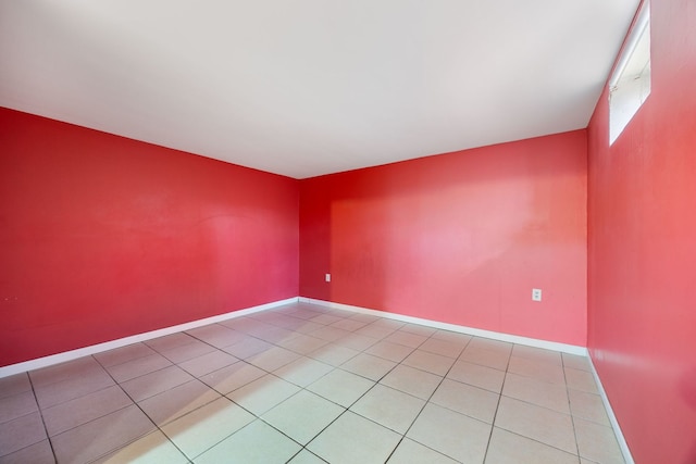 empty room featuring tile patterned floors