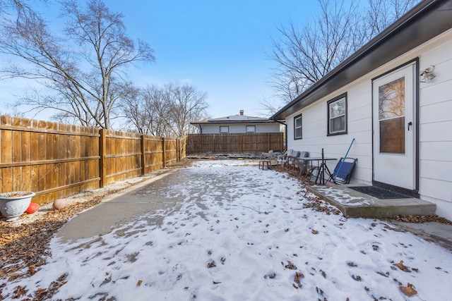 view of yard layered in snow