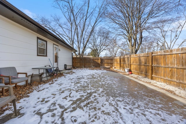 view of yard covered in snow