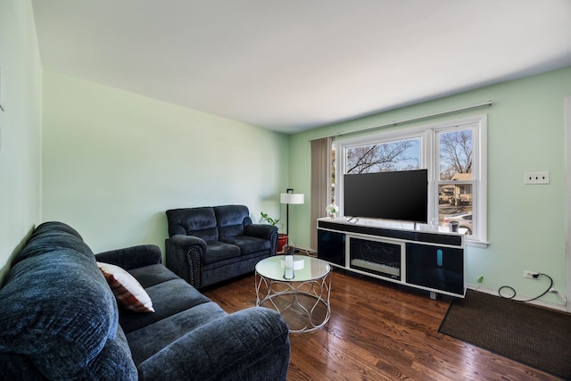 living room with dark hardwood / wood-style flooring