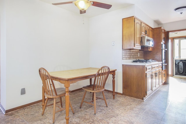 dining space with ceiling fan