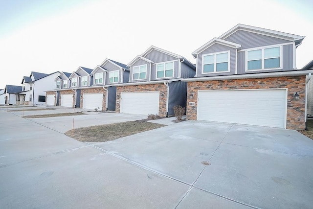 townhome / multi-family property featuring a garage