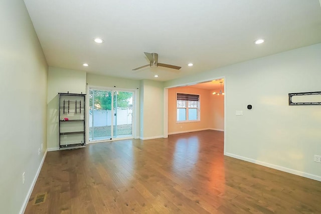 unfurnished room featuring ceiling fan and dark hardwood / wood-style floors