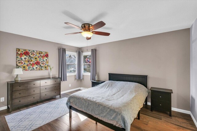 bedroom featuring dark hardwood / wood-style flooring and ceiling fan