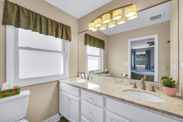 bathroom with vanity and toilet