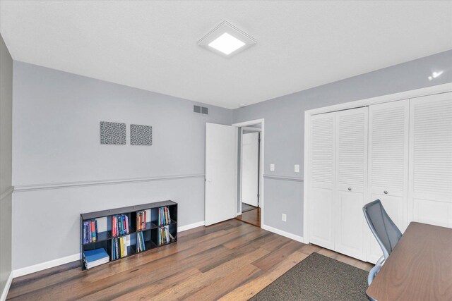 office space with dark hardwood / wood-style flooring