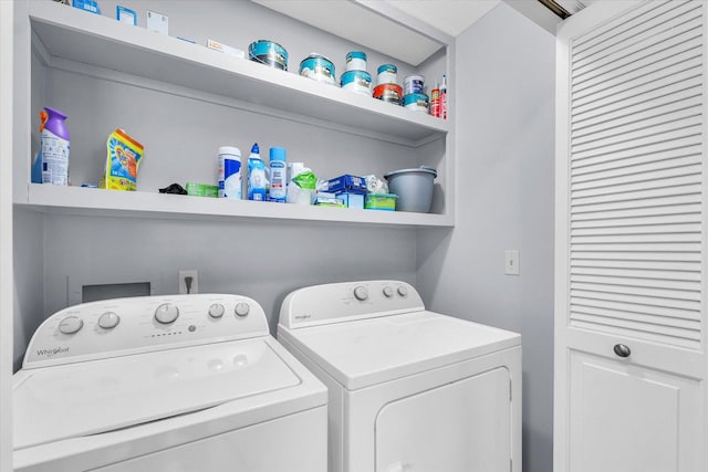 clothes washing area with washer and clothes dryer