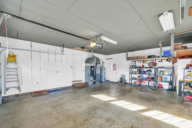 garage featuring a garage door opener and gas water heater