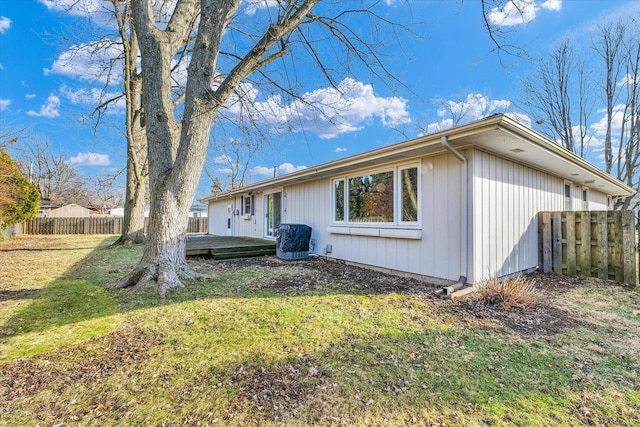 rear view of property featuring a yard