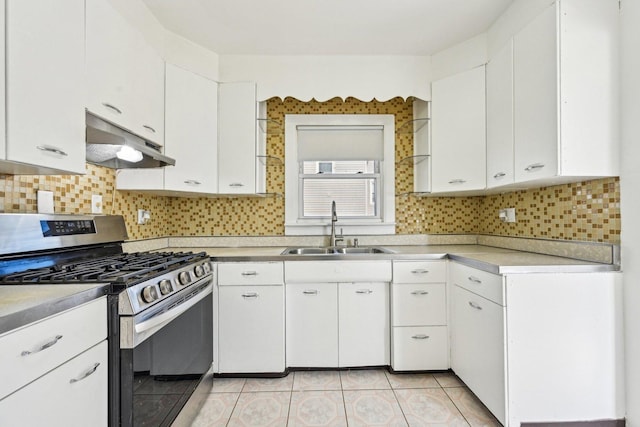 939 N Grace St, Lombard, IL 60148 - kitchen with white cabinetry, sink, stainless steel gas range, and decorative backsplash