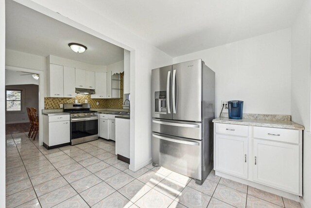 939 N Grace St, Lombard, IL 60148 - kitchen with sink, light tile patterned floors, appliances with stainless steel finishes, white cabinets, and decorative backsplash