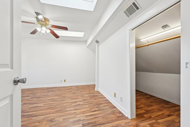 939 N Grace St, Lombard, IL 60148 - interior space featuring hardwood / wood-style flooring, vaulted ceiling with skylight, and ceiling fan