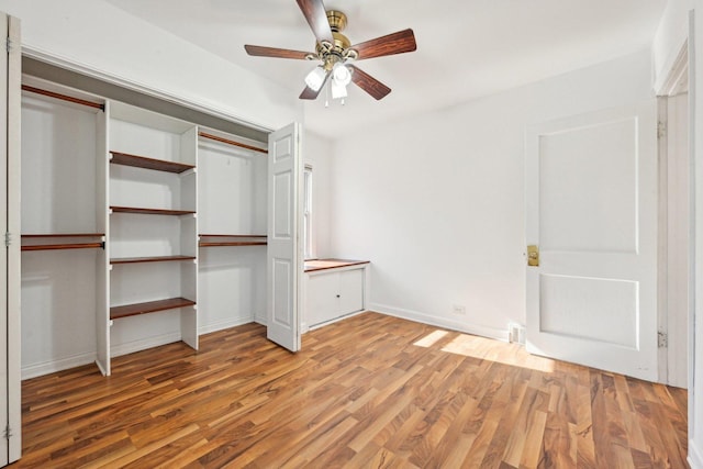 939 N Grace St, Lombard, IL 60148 - unfurnished bedroom with ceiling fan, wood-type flooring, and a closet