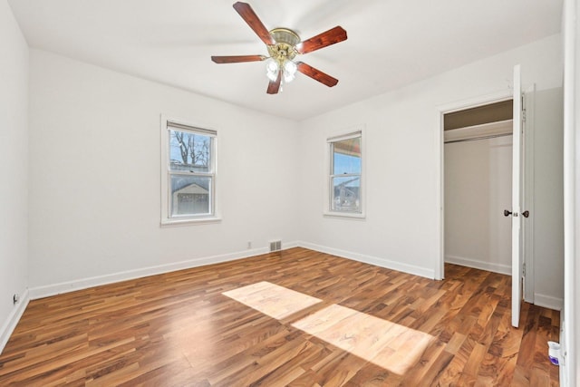 939 N Grace St, Lombard, IL 60148 - unfurnished bedroom featuring hardwood / wood-style floors, ceiling fan, and a closet