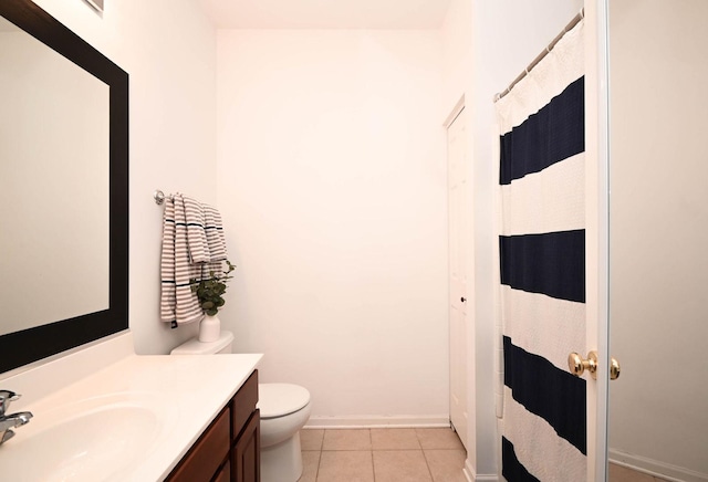 bathroom with tile patterned flooring, vanity, a shower with curtain, and toilet