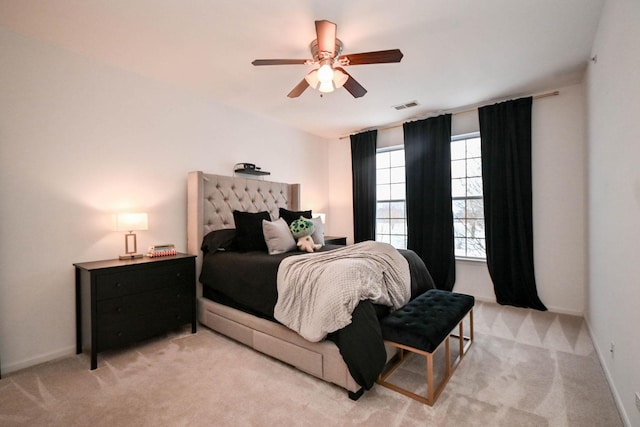 bedroom featuring ceiling fan and light colored carpet