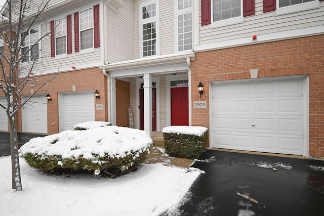 view of front of property with a garage