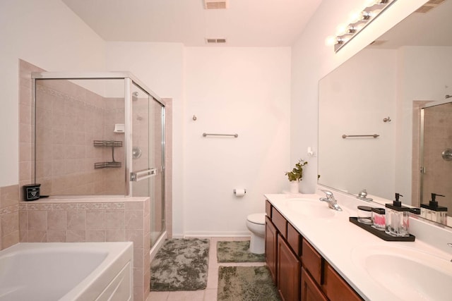 full bathroom with independent shower and bath, vanity, tile patterned floors, and toilet