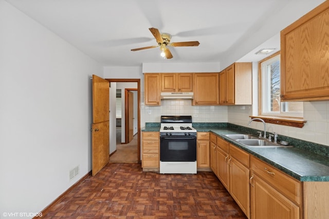 kitchen featuring decorative backsplash, dark parquet flooring, sink, and gas range gas stove