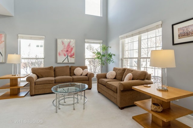 living room with a towering ceiling