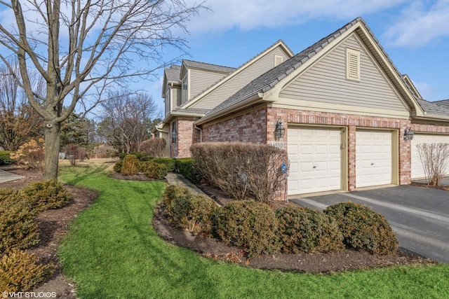 view of home's exterior featuring a garage and a yard