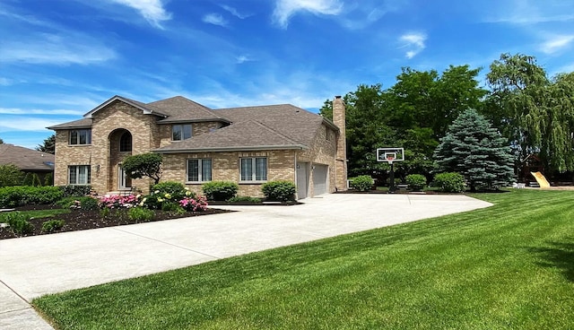 view of front facade featuring a garage and a front yard