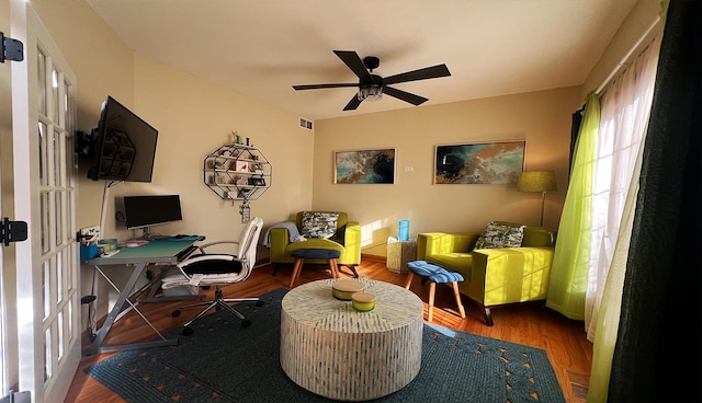 interior space featuring hardwood / wood-style floors and ceiling fan