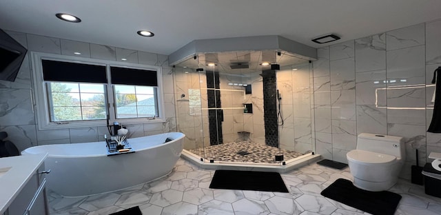 full bathroom with plus walk in shower, tile walls, vanity, and toilet