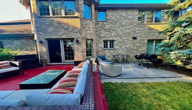 rear view of house featuring an outdoor living space and a wooden deck