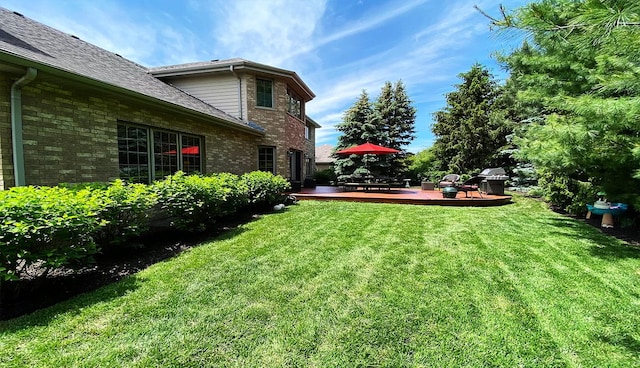 view of yard with a wooden deck