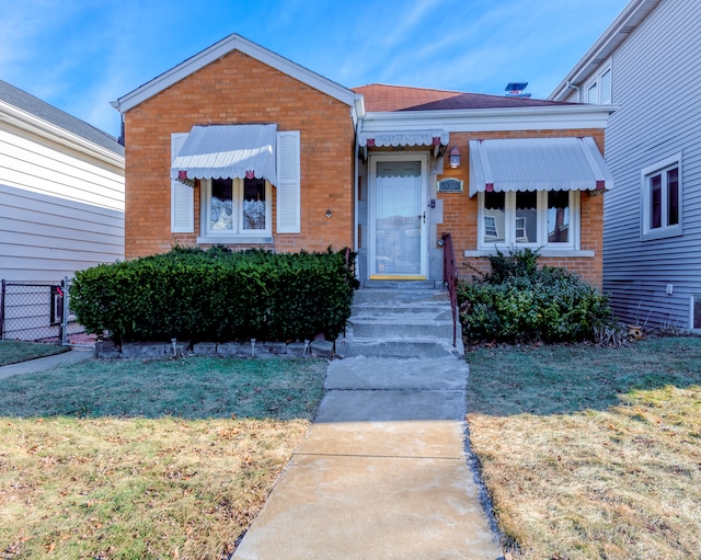 view of front of house with a front lawn