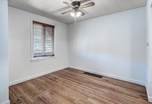 empty room featuring ceiling fan and light hardwood / wood-style flooring