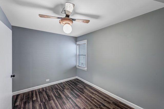 empty room with dark wood-type flooring and ceiling fan