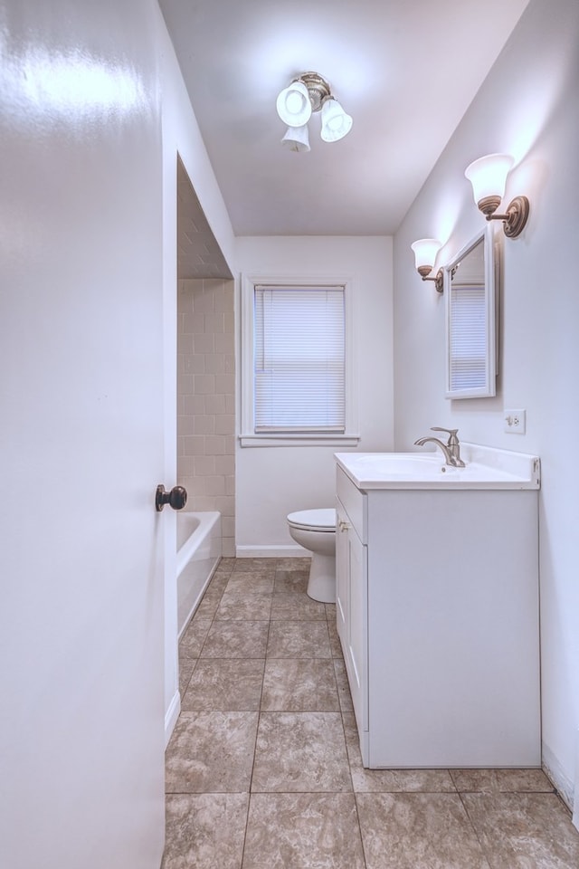 bathroom with tile patterned floors, vanity, and toilet