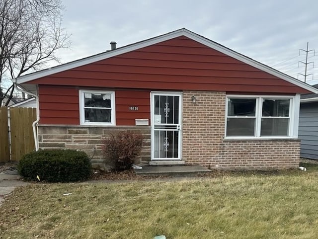 rear view of house with a lawn